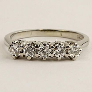 Lady's Delicate Five (5) Diamond and 14 Karat White Gold Ring.
