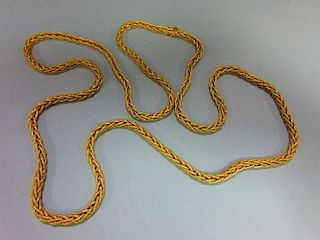 A substantial foxtail link long chain, stamped '750' for 18ct gold, the supple and textured links to