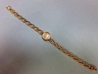 A Jaeger-LeCoultre lady's 18ct gold wristwatch with diamond set bracelet, the small circular cream c