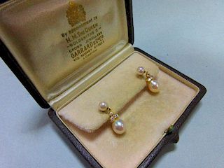 A pair of pearl and diamond earpendants cased by Garrard, each post headed by a 5mm pearl and suspen