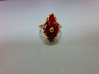 A modern red hardstone ring, the four diaper step cut deep crimson red stones, believed to be synthe