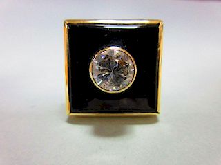 A 2ct diamond, onyx and gold modern handmade designer ring, the round brilliant cut diamond collet s