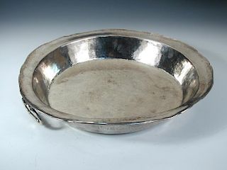 A large shallow metalwares two handled cooking pan, unmarked but believed to be Peruvian, with slopi