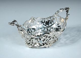 A small Dutch metalwares sweetmeat basket, bearing marks for Amsterdam 1851, of oval shape the body