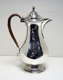 An Edwardian silver hot water jug, by Marston & Bayliss, Birmingham 1905, the plain baluster body ra