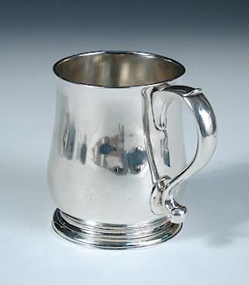 A small George II silver beer mug, probably by William Fordham, London 1728, of plain baluster form