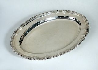 A George II silver meat plate, by John Hugh Le Sage, London 1742, of oval shape with gadrooned edge,