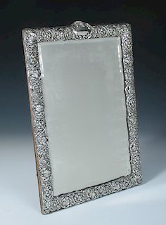 An Edwardian silver mounted dressing table mirror, by H Matthews, Birmingham 1903, rectangular, the