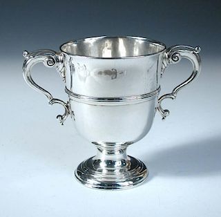 A George III Irish silver two handled cup, by Matthew West, Dublin 1771, of inverted bell shape rais