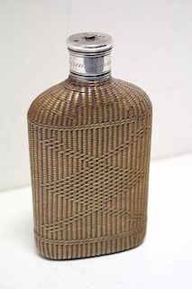 An early Victorian woven cane clad glass dropper bottle, the silver mount by Charles Rawlings & Will