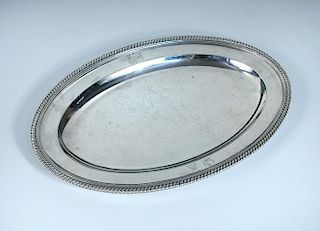 A George III silver meat plate, by Timothy Renou, London 1802, oval with gadrooned edge, crested, 38