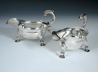 A pair of George II silver sauce boats, by John Swift, London 1741, each of oval shape with cut edge