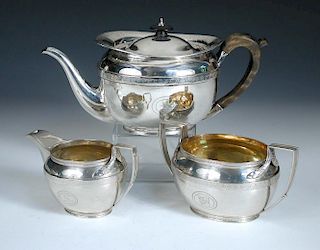 A George III silver three piece tea set by John Emes, London circa 1805, comprising a teapot of oval