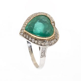 18 K white gold ring with a 4.15 cts. heart cut emerald set in yellow gold.