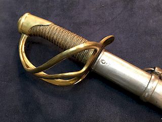 A 19th century French cavalry sword, the blade dated 1877, with brass three loop guard and wire boun