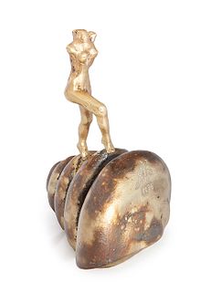 SALVADOR DALÍ I DOMÈNECH (Figueras, Girona, 1904 - 1989). "Nude woman climbing the stairs", 1974. Sculpture in 18kt yellow gold on silver pedestal.