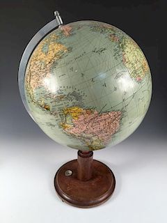 A 1930's terrestrial 12 inch table globe, mounted on a turned wooden base with inset compass 53cm (2
