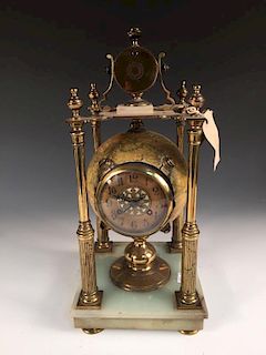 A novelty mantle clock, with movement mounted within a Smith's terrestrial 6 inch globe, to a gilt b
