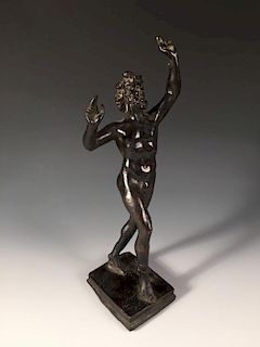 An early 19th century bronze model of the dancing faun after the Antique, mounted on a stepped recta