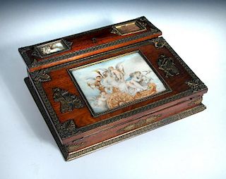 A Continental 19th century gilt mounted mahogany writing slope, the fold over hinged slope with inse