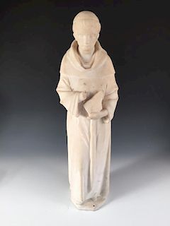 A 19th century white marble figure of a monk, the tonsured figure standing holding a book in his lef