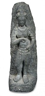 A Gandharan schist goddess, possibly Hariti and 2nd-3rd century AD, she stands draped only in jewels