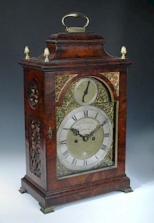 A George III mahogany bracket clock, the bell top case with brass handle and four gilt finials above