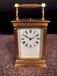 A French gilt brass carriage clock with repeat, the pillared case with silvered platform lever escap