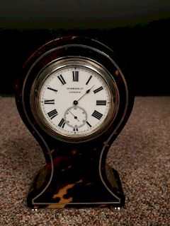 An Edwardian small size tortoiseshell mantle clock, the balloon shape case with 4.5cm (2in) enamel d