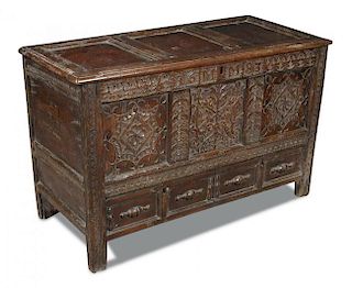 A 17th century panelled oak mule chest, carved with date 1683 and to the front panels, moulded drawe