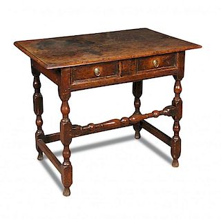 A late 17th century oak side table, fitted a single drawer with panel moulded front, brass ring hand