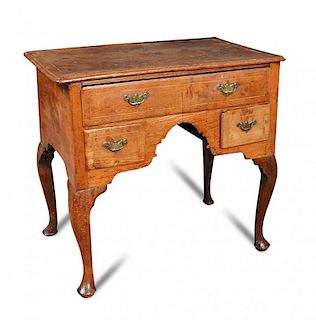 An early 18th century oak lowboy, boxwood line inlaid border decoration, fitted one long and two sho