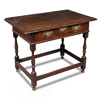 An early 18th century oak side table, with single drawer, engraved brass lock plate and handles on b