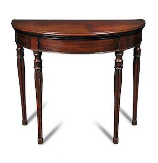 A George IV mahogany demi lune card table, with foldover top, green velvet lined interior, on cluste