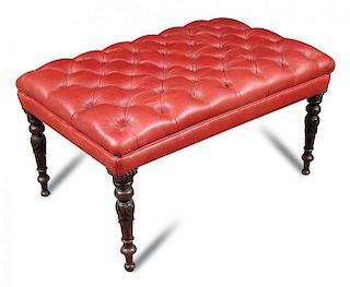 A red leather upholstered footstool, buttoned seat on carved mahogany and turned legs 48 x 92 x 60cm