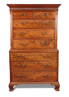 A George III mahogany chest on chest, with dentil moulded cornice, canted reeded sides, fitted two s
