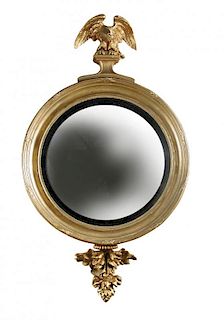 A Regency gilt painted convex circular wall mirror, with Eagle cresting and leaf carved apron 107 x