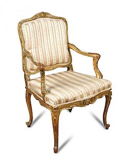 A pair of French Regency revival giltwood salon chairs, circa 1870, leaf and scroll carved frames wi