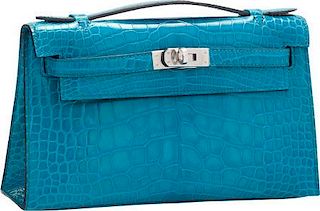 Hermes Shiny Blue Izmir Alligator Kelly Pochette Bag with Palladium Hardware Excellent to Pristine Condition 8.5" Width x 5" Height x 2.5" Depth