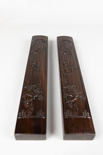 A Pair of Carved Mahogany Paper Weight
