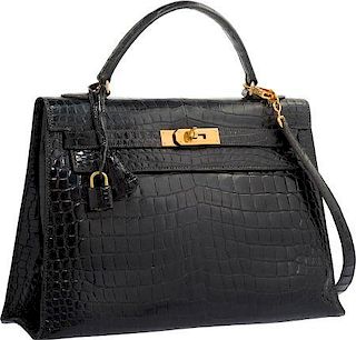 Hermes 32cm Shiny Black Porosus Crocodile Sellier Kelly Bag with Gold Hardware Good to Very Good Condition 12.5" Width x 9" Height x 4" Depth
