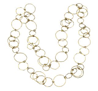 Cartier 18 Karat Gold Necklace, having various size circles, signed Cartier # 53435, total length 39 inches.