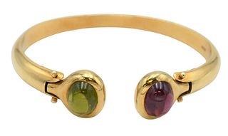 18 Karat Yellow Gold Bangle Style Bracelet, two cabochon cut stones on hinges to open, 40.6 grams.