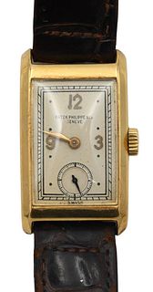 Patek Philippe Vintage 18 Karat Gold Rectangular Men's Wristwatch, having original leather Patek Philippe band with 18 karat gold buckle with second h