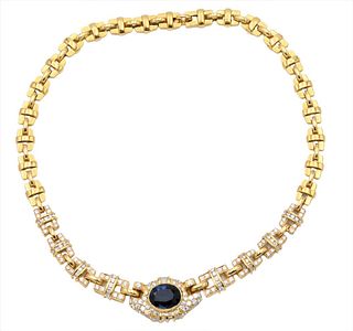 18 Karat Yellow Gold Necklace, with large rectangle links and oval mixed cut dark blue sapphire, 12.03 carats, necklace is set with round diamonds, pe