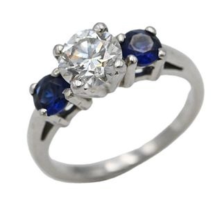 18 Karat White Gold Ring, set with center diamond, approximately 1 carat, flanked by blue sapphires, size 4.