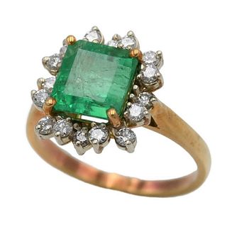 18 Karat Yellow Gold Ring, set with emerald surrounded by 16 round cut diamonds, emerald is 7.2 x 7.8 millimeters, size 5 3/4.