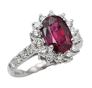 18 Karat White Gold Ring, set with oval brilliant cut ruby, 2.42 carats; surrounded by 14 diamonds; 8 diamonds on ring; along with G.I.A. report and a