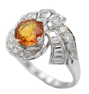 Platinum Ring, set with golden yellow sapphire, round and baguette diamonds, sapphire is 3 carats, 31 diamonds, total 1.25 carats, along with an appra