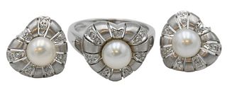 18 Karat White Gold Three Piece Set, to include a ring, size 6 1/2; along with a pair of pierced earrings, each set with center pearl and small diamon